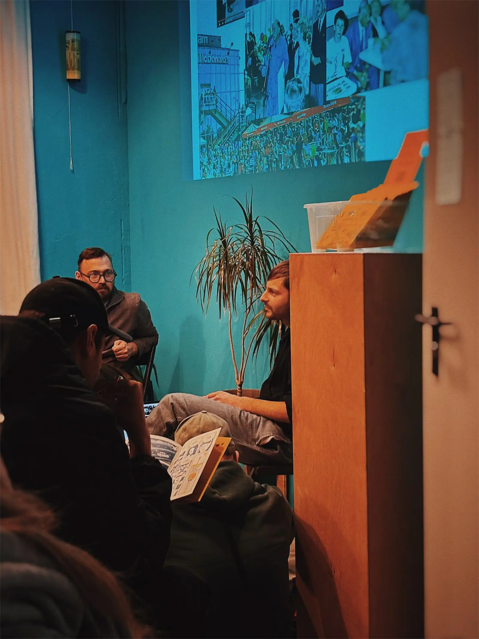 Premiere of the zine. The audience, the meeting leader and the author of the comic book.